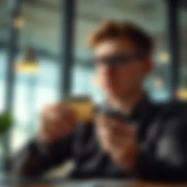 Evaluating Credit Card Choices for Business A person reviewing credit card options for business expansion