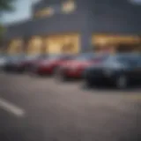 A diverse lineup of vehicles parked outside a credit union.