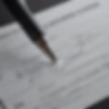 A close-up of a signed vehicle title with a pen.