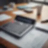 A calculator and financial documents laid out on a desk, symbolizing financial planning.