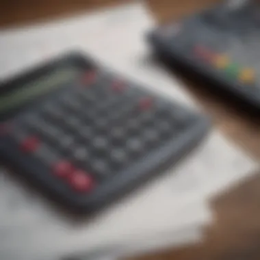 A close-up view of a calculator alongside financial documents, representing careful calculation.