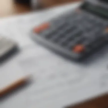 A close-up shot of a financial calculator with mortgage documents spread out.