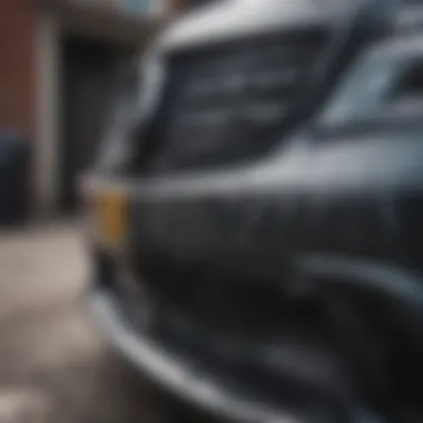 Close-up of a Mercedes Benz bumper showing damage.