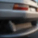 Close-up view of a damaged rear bumper with scuff marks.