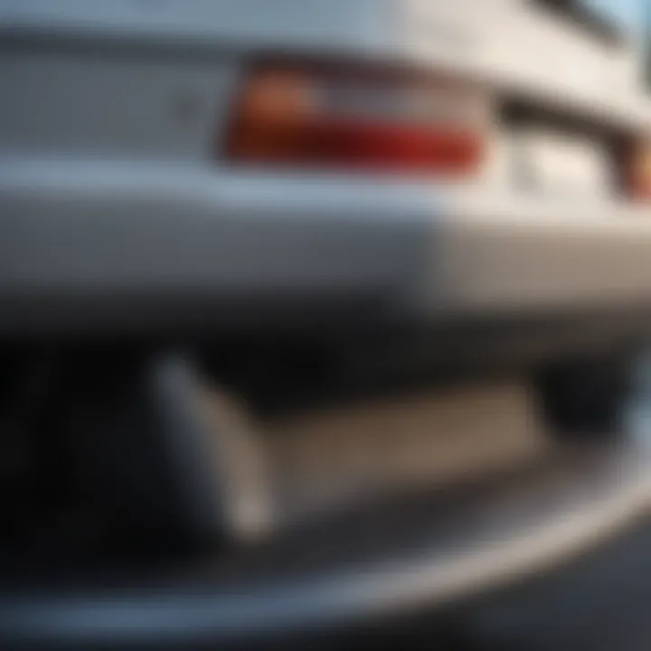 Close-up view of a damaged rear bumper with scuff marks.